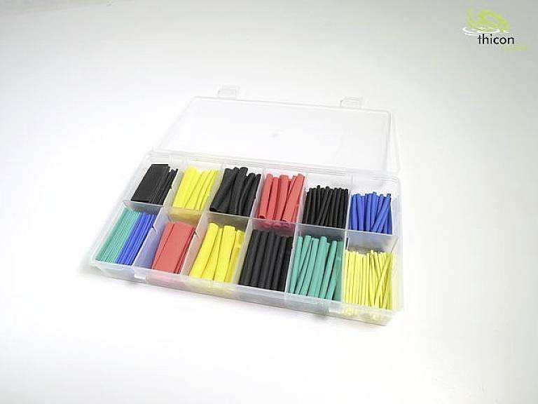 Une boîte ouverte contenant divers tubes thermorétractables de différentes couleurs, triés et rangés dans des compartiments.