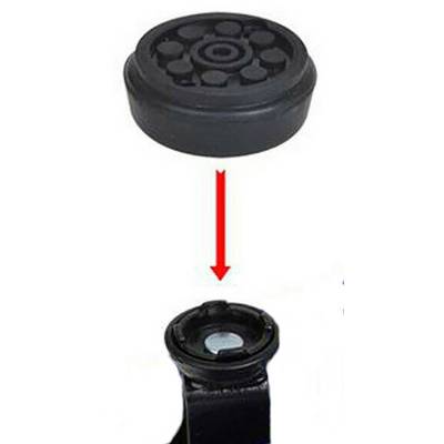 Une pièce de rechange ronde en caoutchouc avec une flèche indique son emplacement sur un morceau de métal.