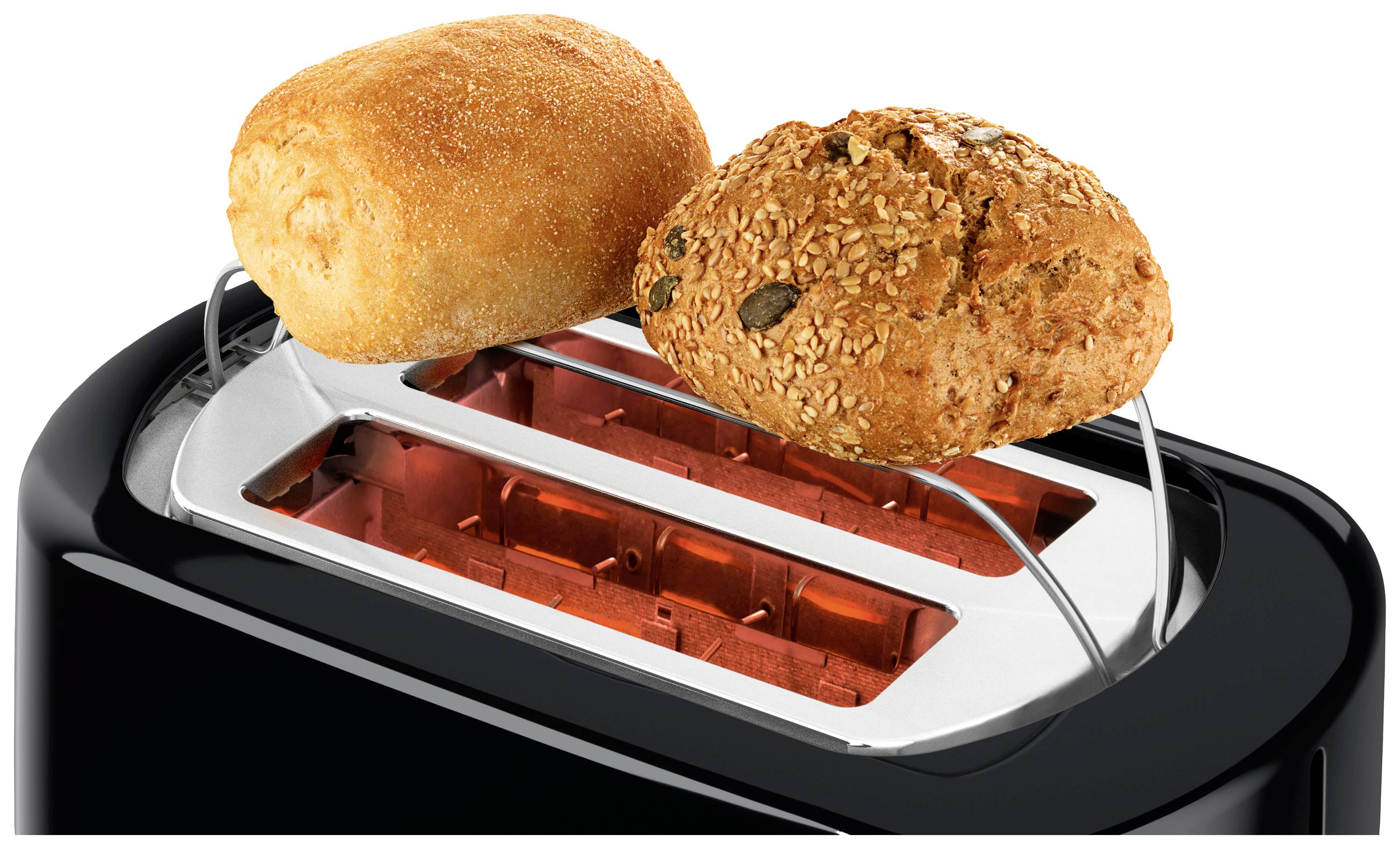 Un grille-pain noir avec deux pains, l'un classiquement clair, l'autre avec des graines, préchauffés sur la grille supérieure.