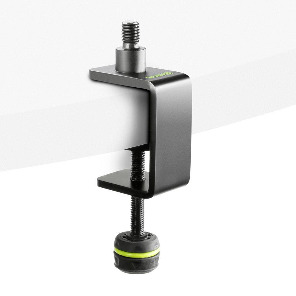 Pince de table métallique de couleur noire, fixée sur un bord de table blanc. Mécanisme à vis pour une fixation solide.