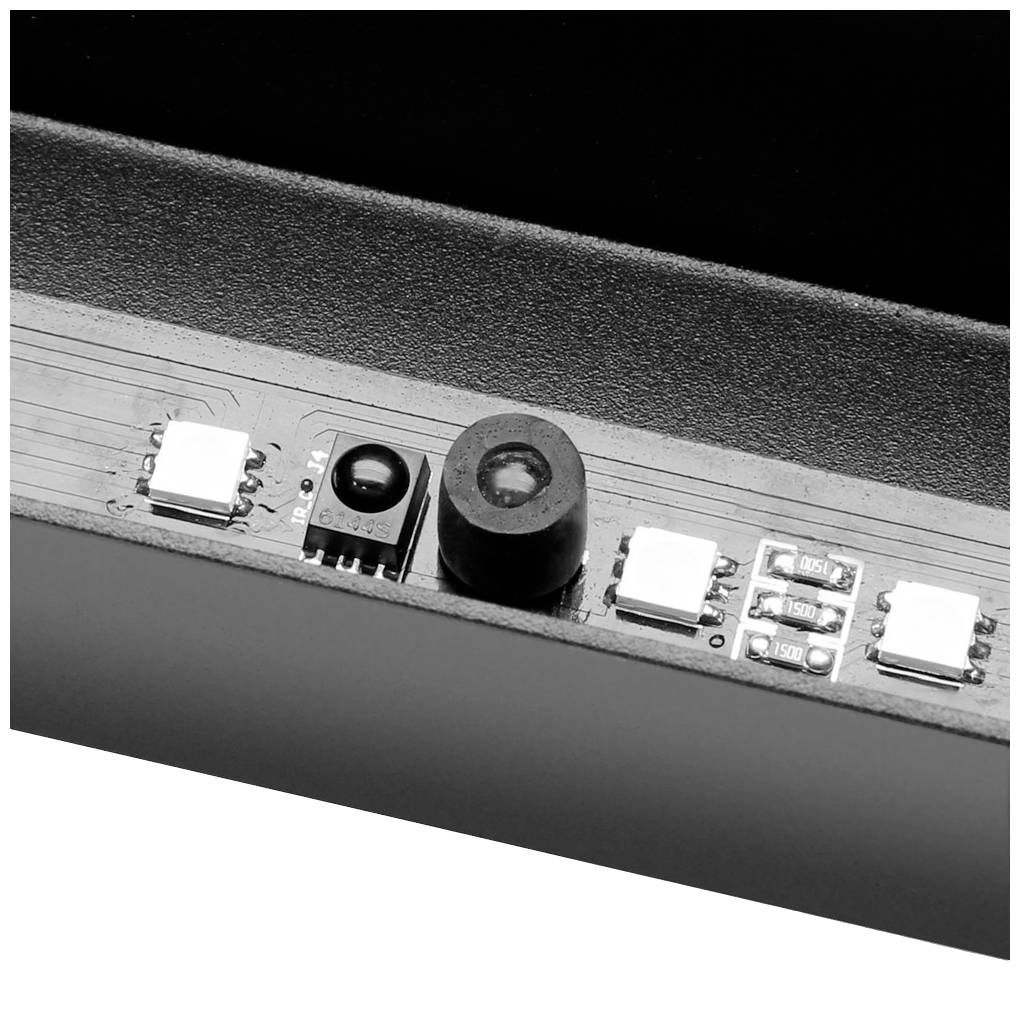 Gros plan d'une puce capteur et d'une lentille, intégrées dans un boîtier noir, flanquées de LED blanches et de microcomposants.