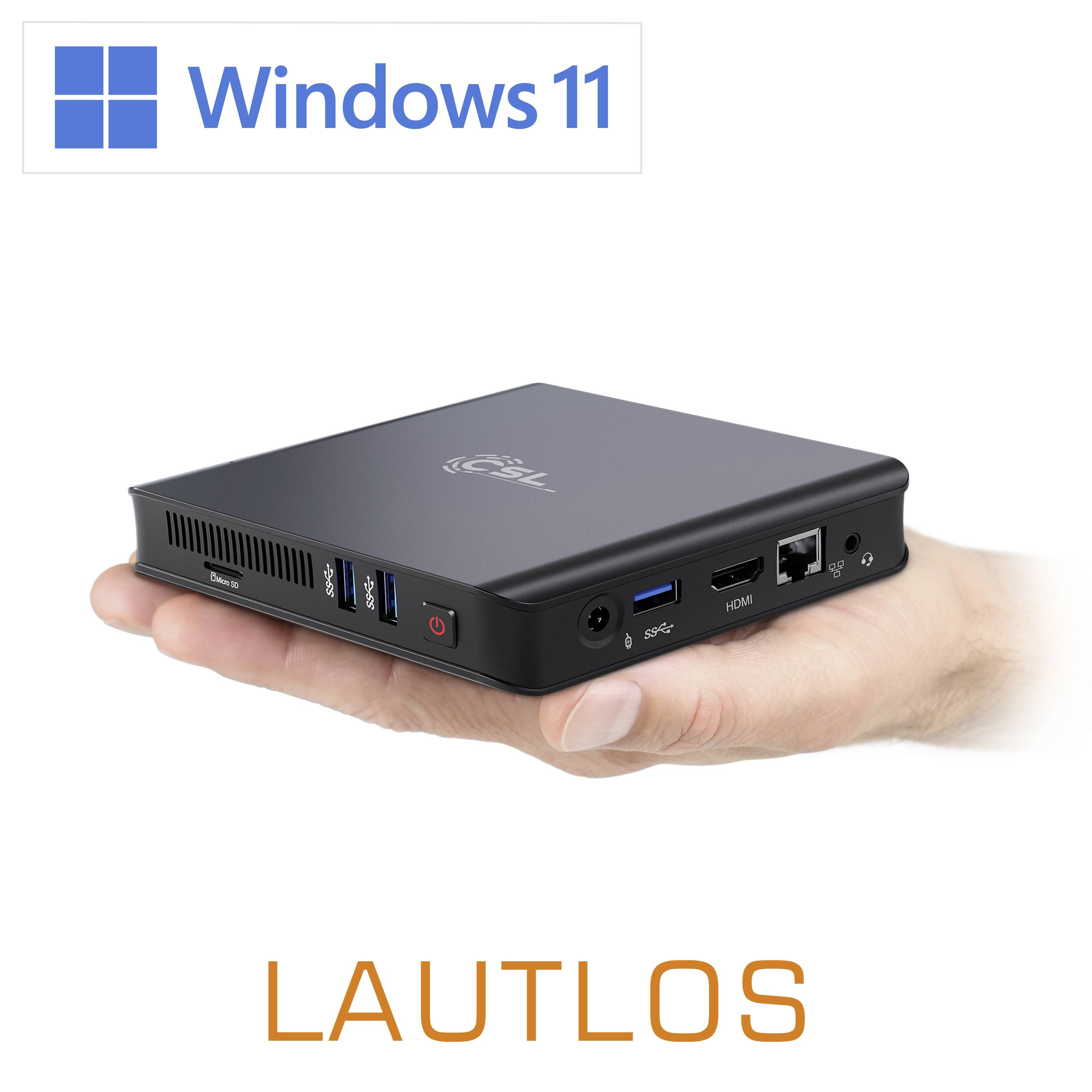 Un mini-PC compact noir avec le logo 'Windows 11' en haut, tenu dans une main. L'inscription 'SILENCIEUX' en dessous.