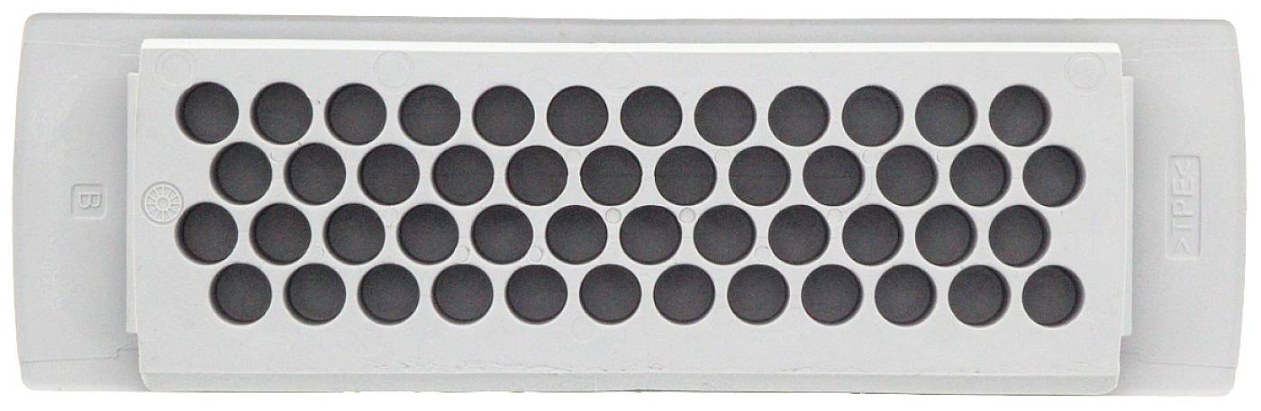 Boîtier en plastique gris rectangulaire avec une structure en grille composée d'ouvertures circulaires au centre.