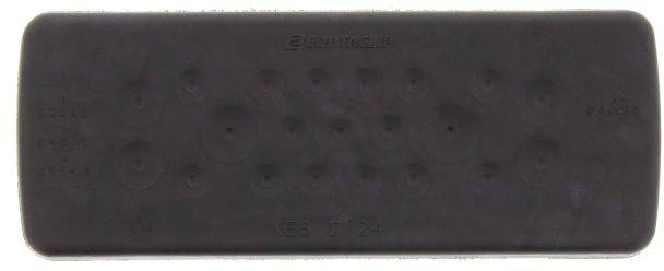 Un appareil rectangulaire noir, probablement une télécommande, avec de petites touches à peine visibles sur sa surface.