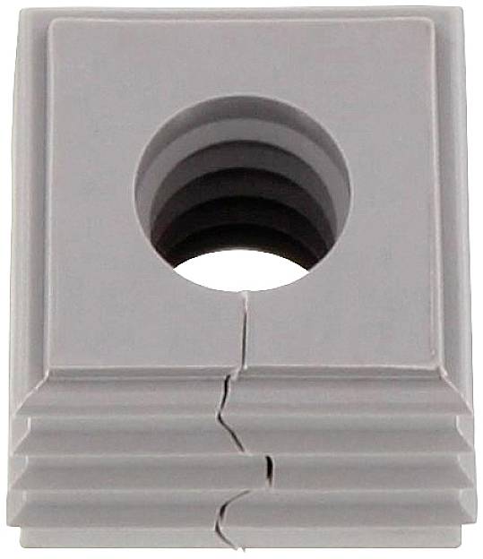 Objet gris carré avec une tubulure verticale centrale et une structure nervurée, présentant une fissure sur sa face inférieure.