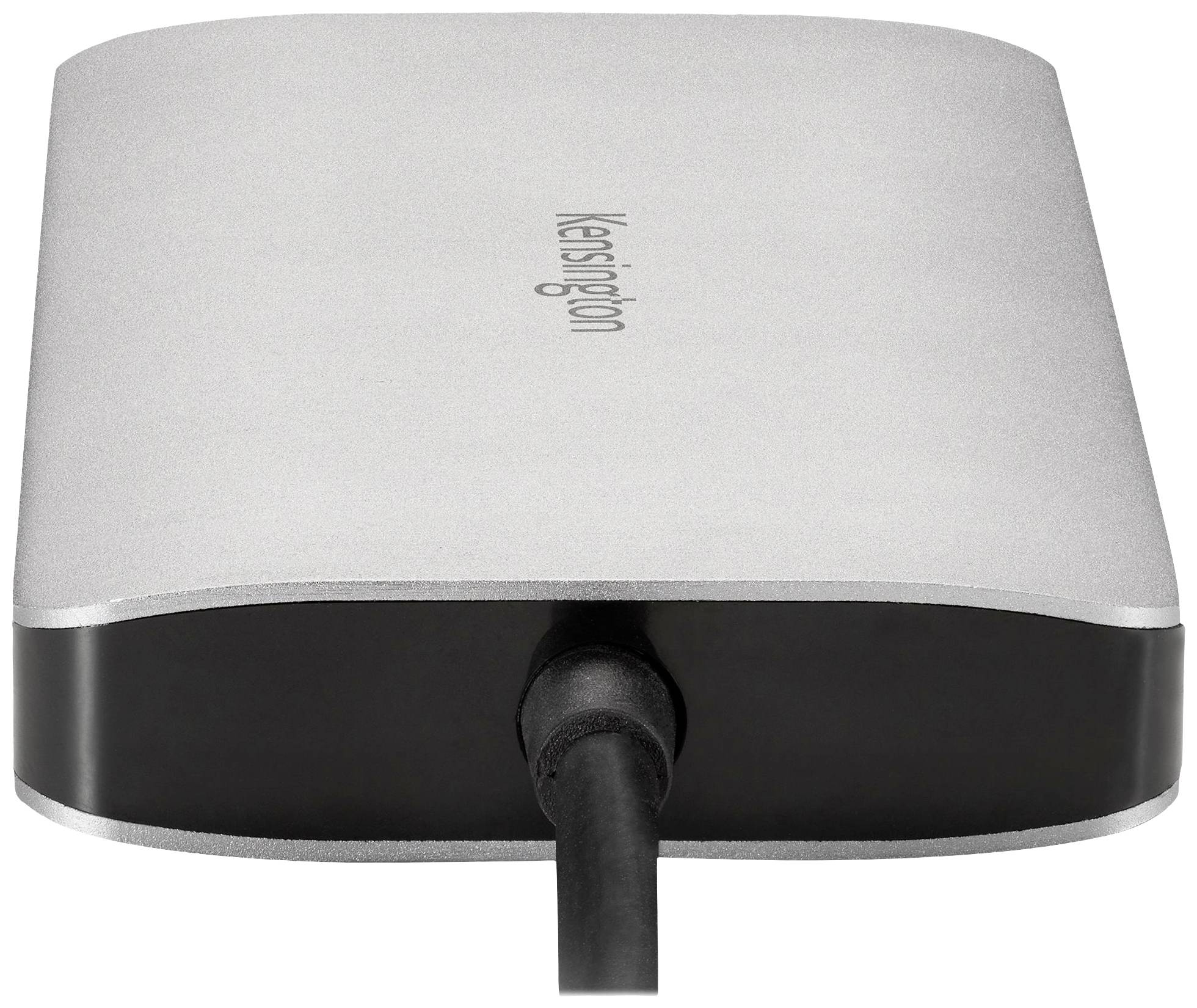 Un lecteur portable argenté portant l'inscription 'Kensington' sur le dessus. Un câble est connecté à l'arrière.