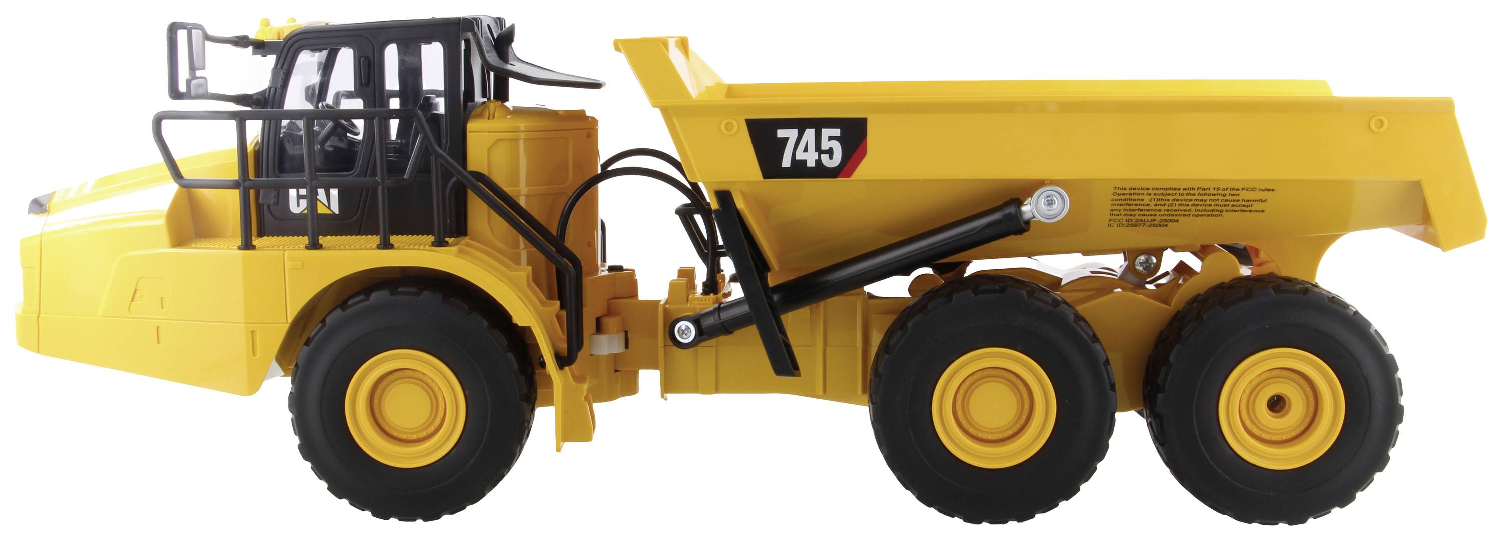 Un camion-benne jaune portant le numéro '745' sur le côté est posé sur un fond blanc. À droite se trouve la benne basculante, à gauche la cabine du conducteur.