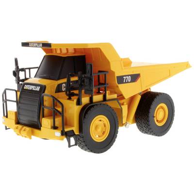 Camion-benne jaune de Caterpillar 770 avec des roues noires, échelle et garde-corps visibles, vue de côté.