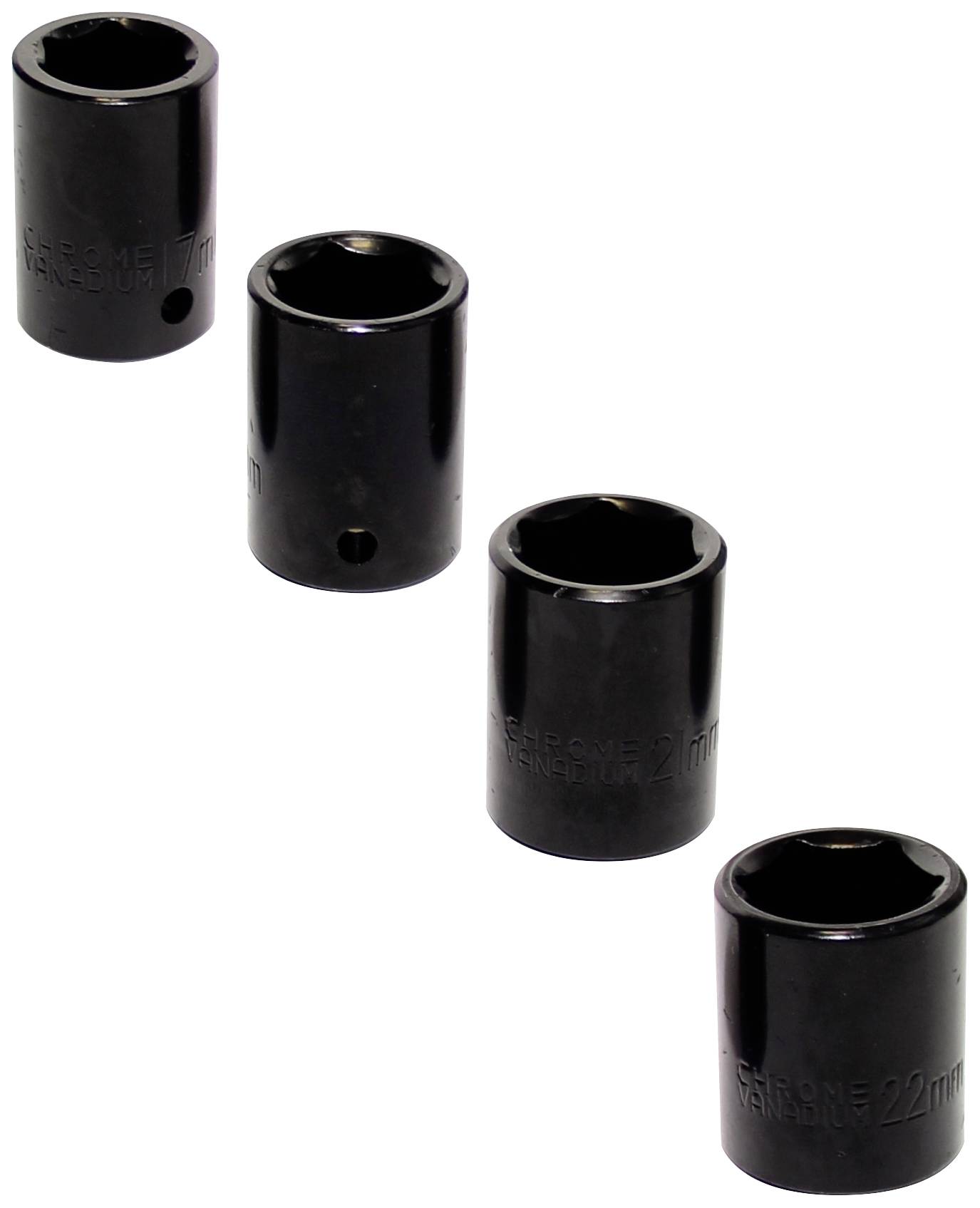 Quatre noix noires de différentes tailles sont disposées sur un fond blanc.