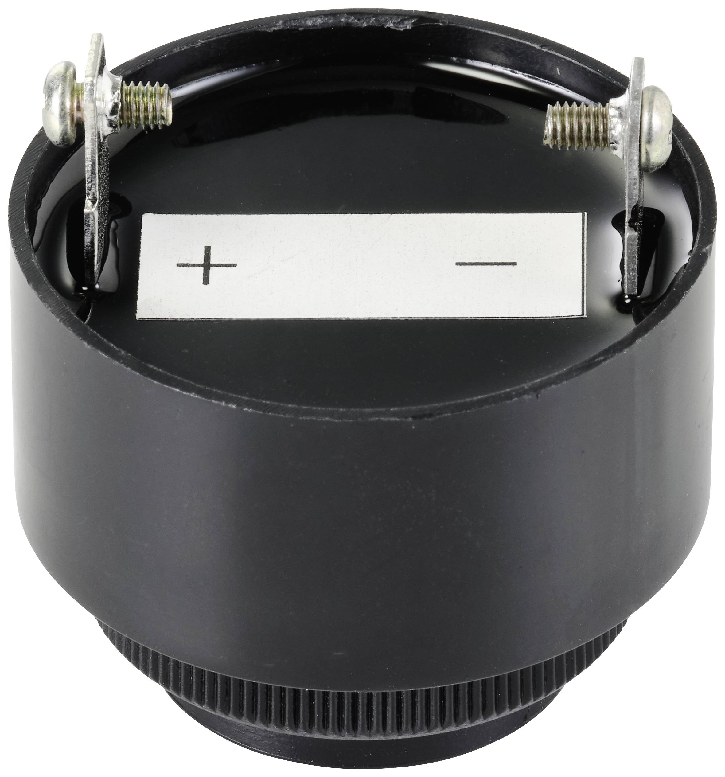 Un haut-parleur rond noir avec deux bornes de connexion, marquées '+' et '-'.