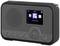 Radio portable Internet noir avec un petit écran, affichant l'heure '03:12' et des icônes d'applications. Touches de volume et de sélection de station en bas.