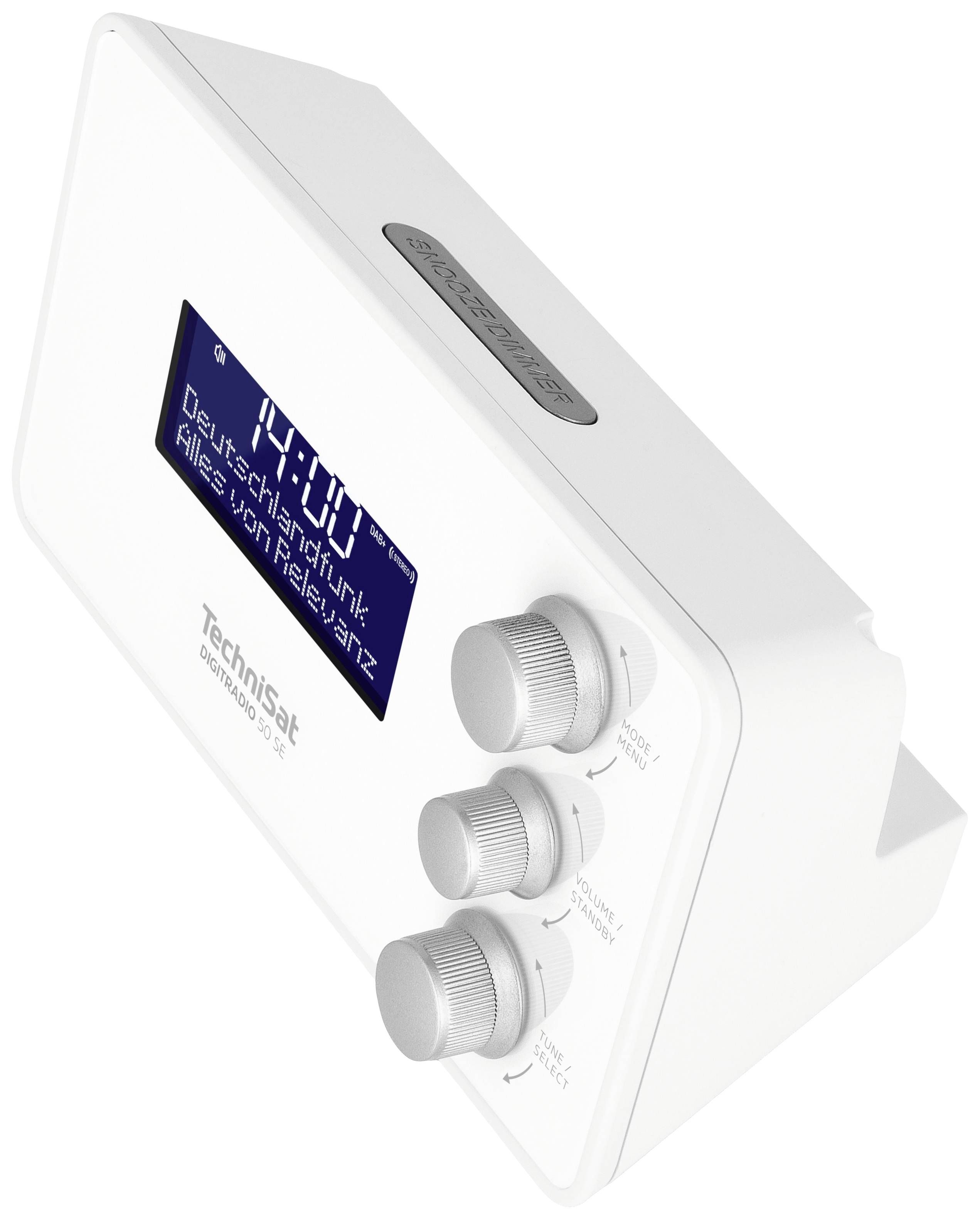 Un poste de radio numérique blanc avec un affichage bleu montre l'heure '10:00'. En dessous, on peut lire 'Deutsch-Hit' et 'Relevanz du Klub' sur l'écran. Trois boutons de réglage sont visibles.