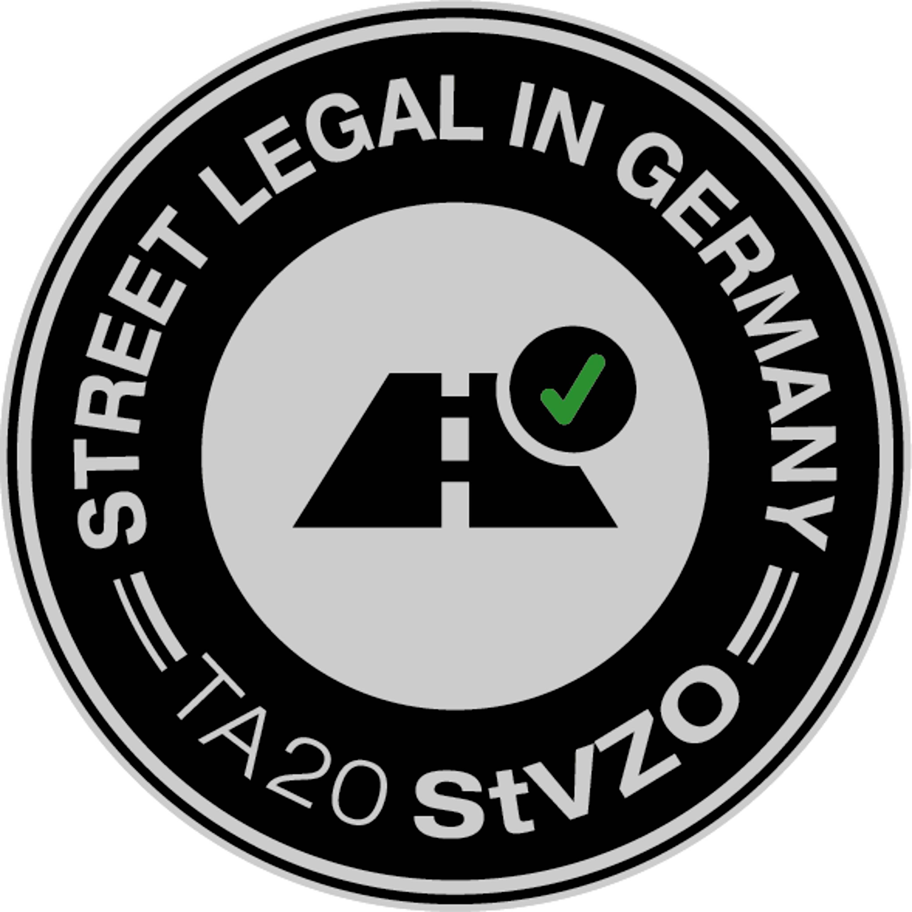 Sur l'image, on peut voir un emblème rond 'Street Legal in Germany TA20 StVZO' avec un symbole routier et une coche verte.