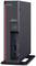 Un client léger Fujitsu Futro noir avec port USB, port pour casque et bouton d'alimentation, posé sur un support.