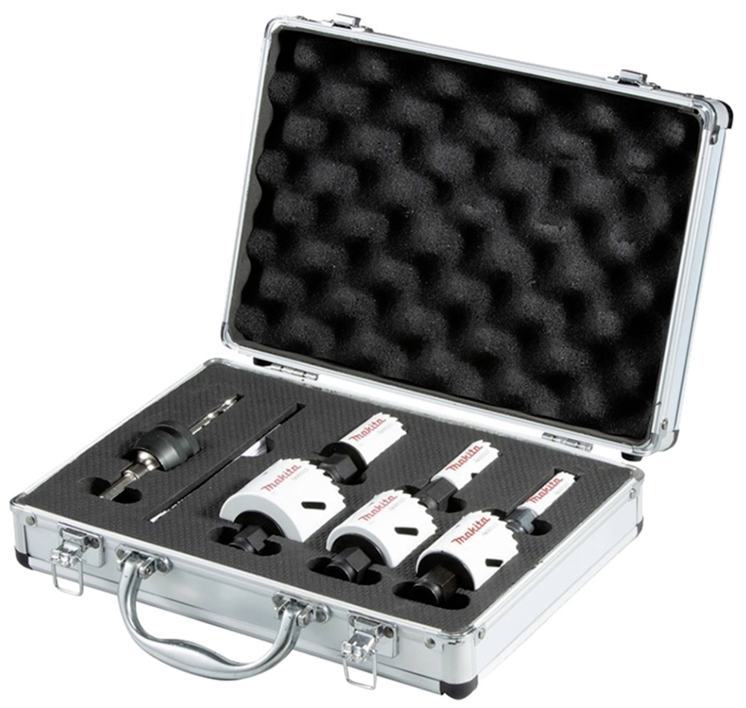 Valise métallique contenant un set de couronnes de forage et ses accessoires, doublée de mousse pour l'organisation et la protection, dans un état ouvert.
