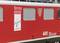 Train rouge portant l'inscription 'Bernina'. Affiche indiquant 'Patrimoine mondial de l'UNESCO'. Modèle du Chemin de fer rhétique, numéro 602, originaire des Grisons.