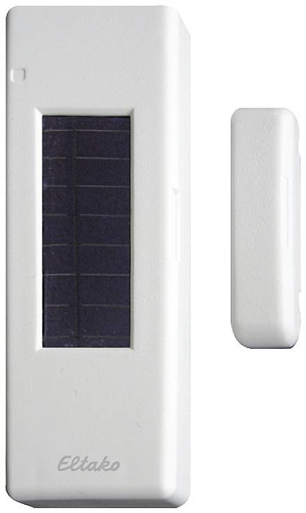'Un détecteur de mouvement blanc rectangulaire avec des cellules solaires sur la face avant.'