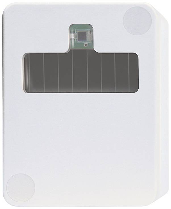 Un appareil rectangulaire blanc avec une fenêtre rectangulaire sombre au centre, probablement un capteur ou un dispositif électronique.