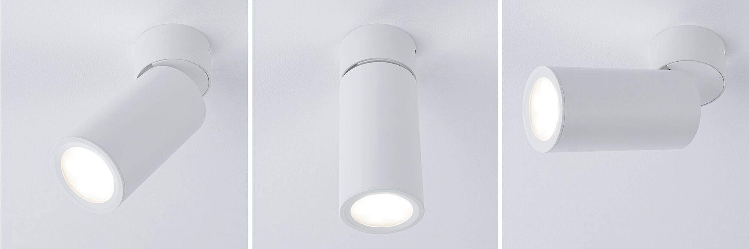 Trois luminaires cylindriques blancs présentés sous différents angles : incliné à gauche, droit au centre, pivotant à droite.