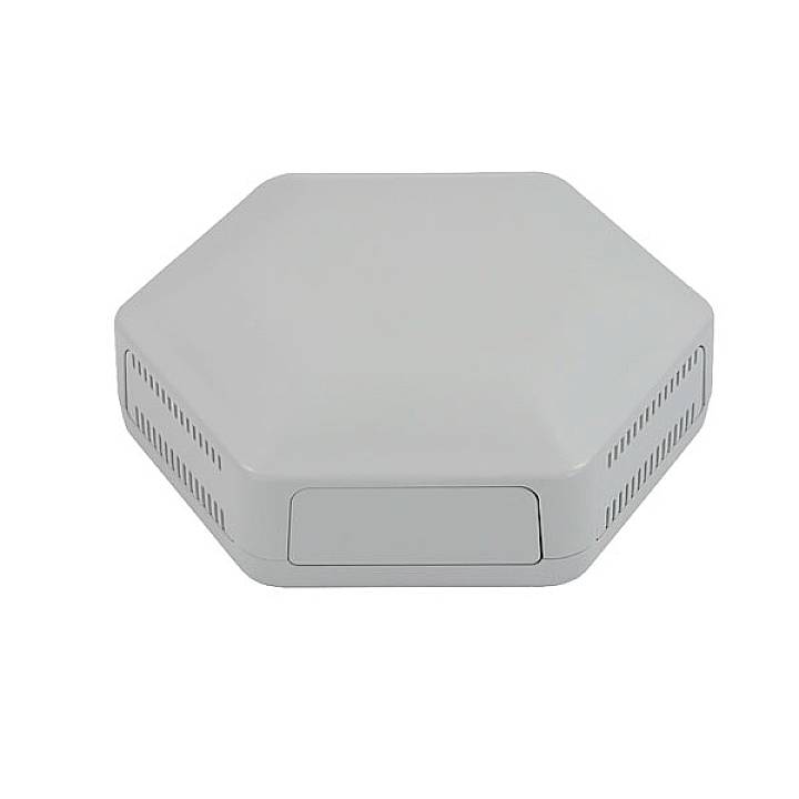 Routeur gris hexagonal avec des fentes de ventilation sur les côtés, au design minimaliste. Adapté pour une installation murale ou au plafond.