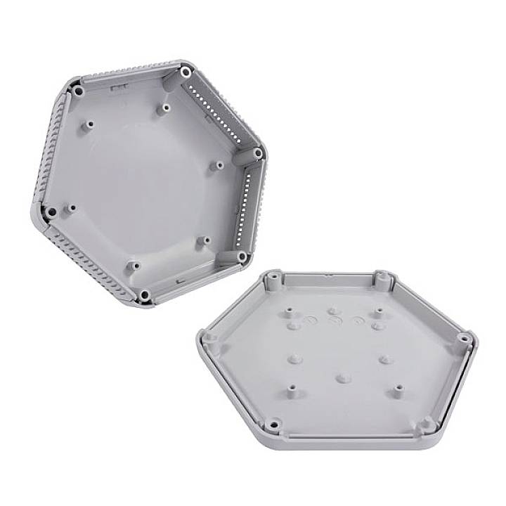 Deux couvercles hexagonaux en plastique, l'un ouvert, montrant l'intérieur avec des points de fixation. Adaptés pour des applications techniques.