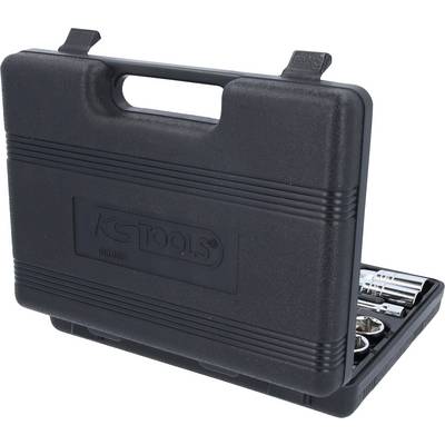 Un coffret noir en plastique portant le logo 'KS TOOLS'. Le coffret est partiellement ouvert et montre des parties d'un ensemble d'outils.
