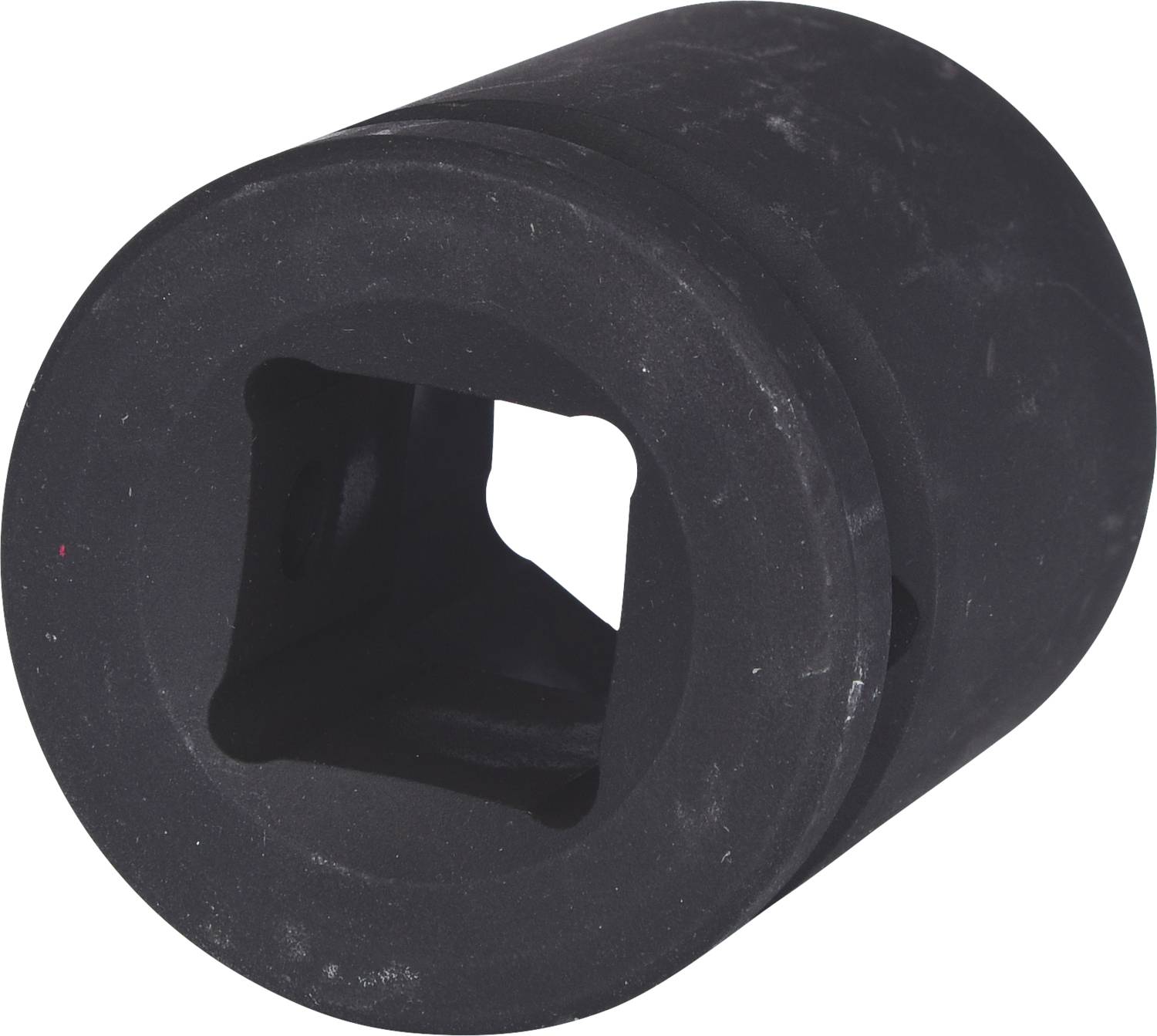 Un adaptateur noir cylindrique avec une ouverture carrée au centre, probablement utilisé pour des connexions d'outils.