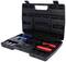 Une valise noire ouverte contenant divers outils, dont des pinces aux poignées rouges et bleues, et plusieurs embouts.