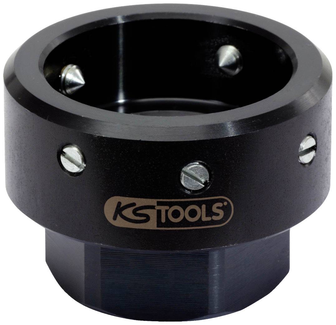 Un outil noir de KS Tools avec plusieurs vis autour du bord, probablement une sorte de manchon ou d'adaptateur, destiné à un usage technique.