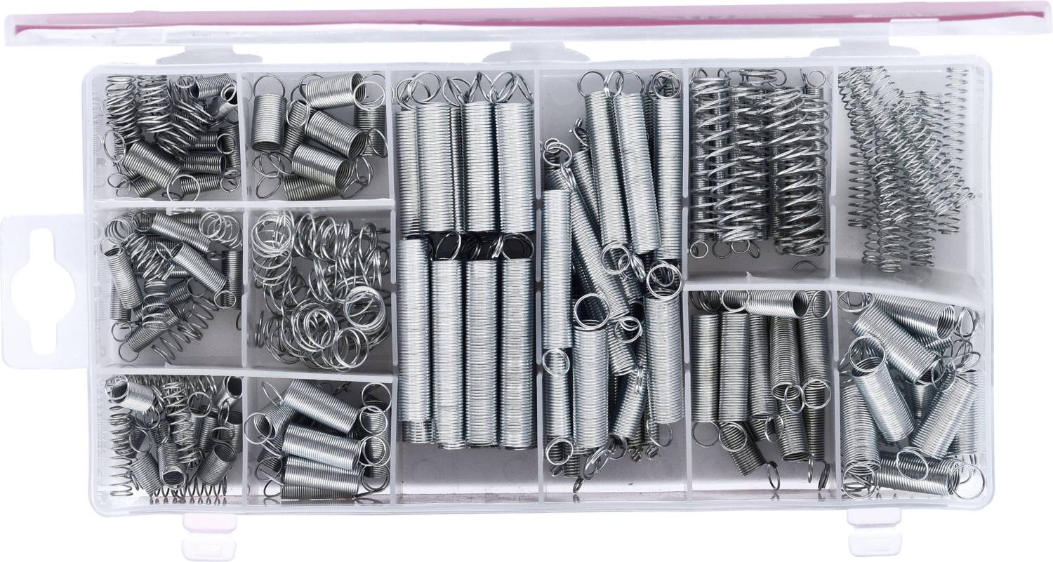 Boîte en plastique contenant différents ressorts métalliques triés par compartiments.