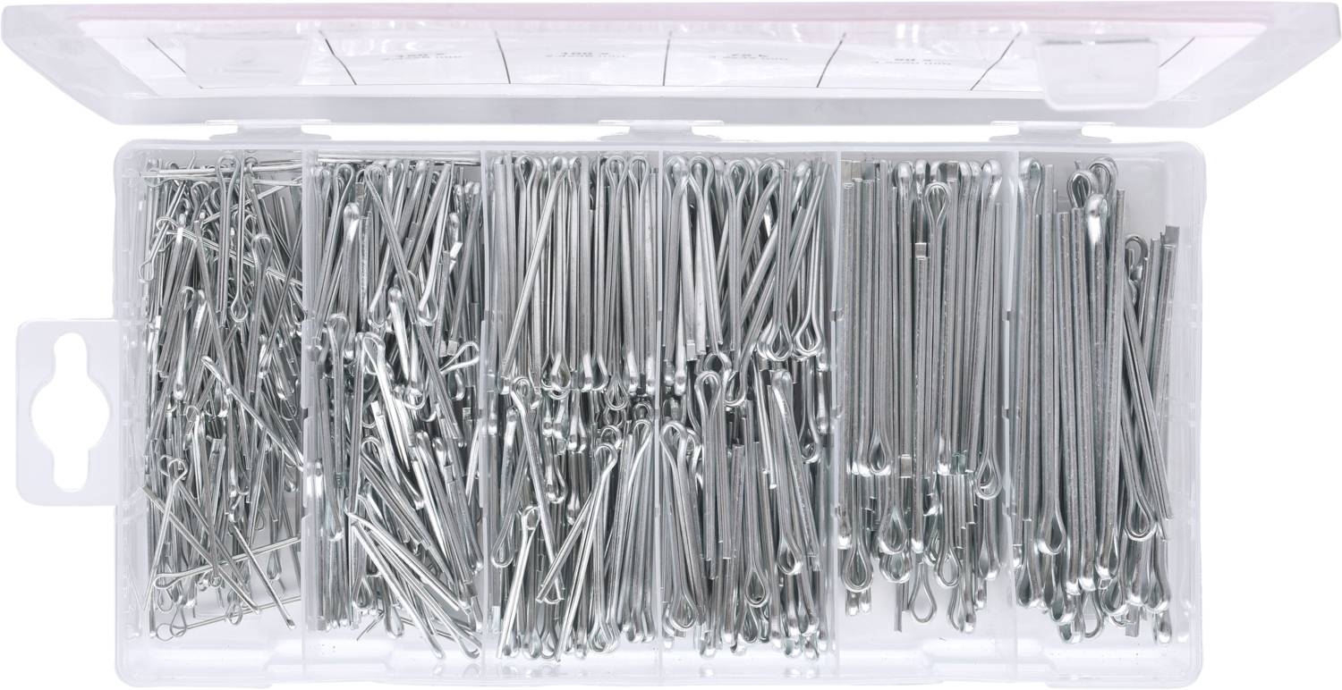 Une boîte ouverte contenant une variété de goupilles métalliques de différentes tailles, soigneusement triées dans des compartiments.