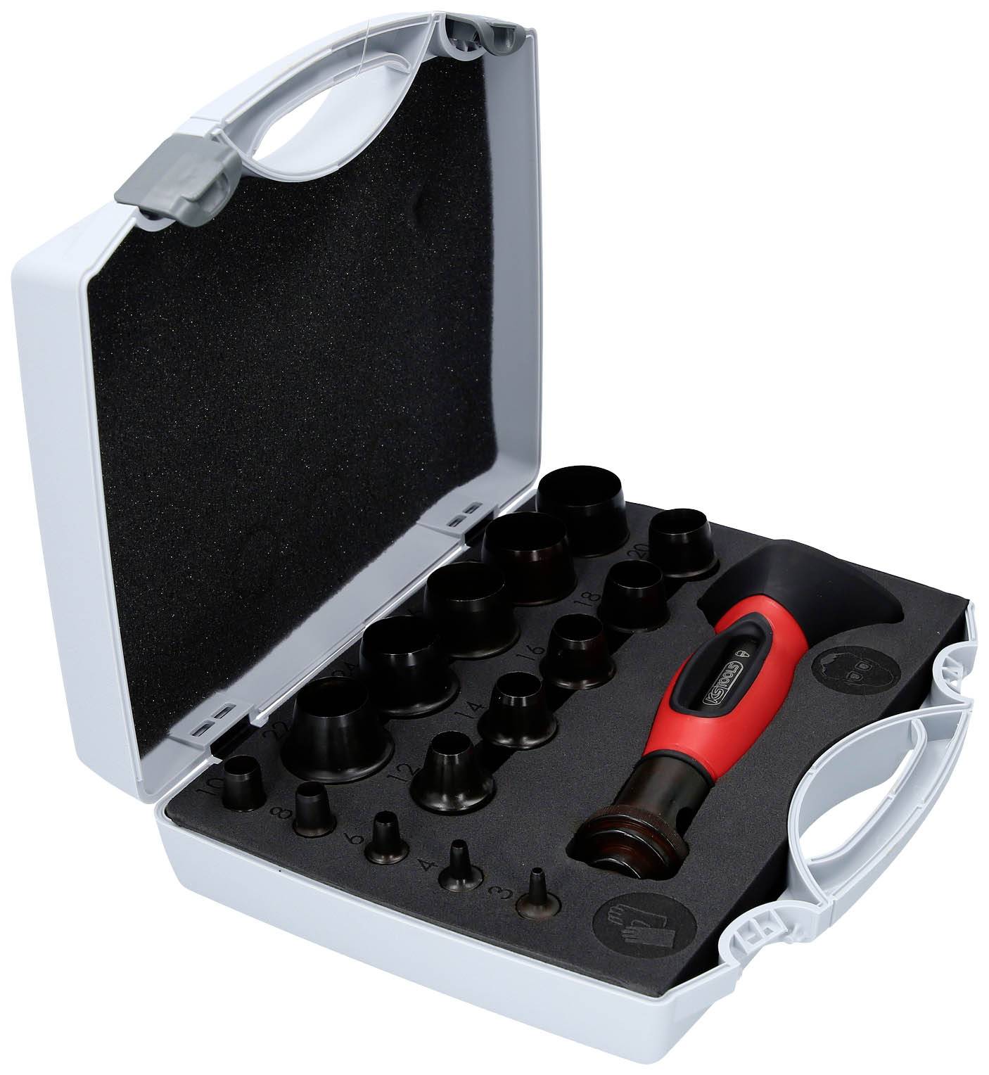Boîte à outils ouverte avec manche de tournevis rouge et différents embouts sur un fond de mousse.