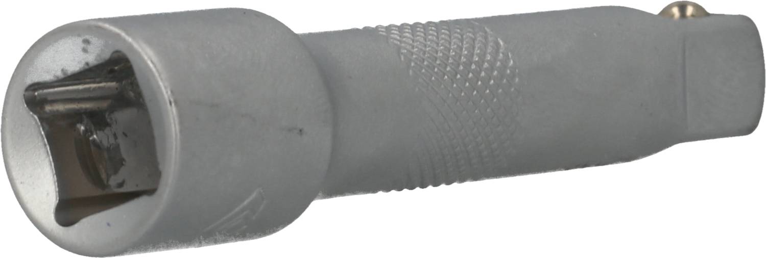 Un dénudeur de câbles gris avec des lames métalliques à une extrémité, adapté pour retirer l'isolation des câbles.