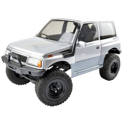Voiture miniature en argent d'un SUV avec de grandes roues tout-terrain, un design robuste et des encadrements de fenêtres noirs.
