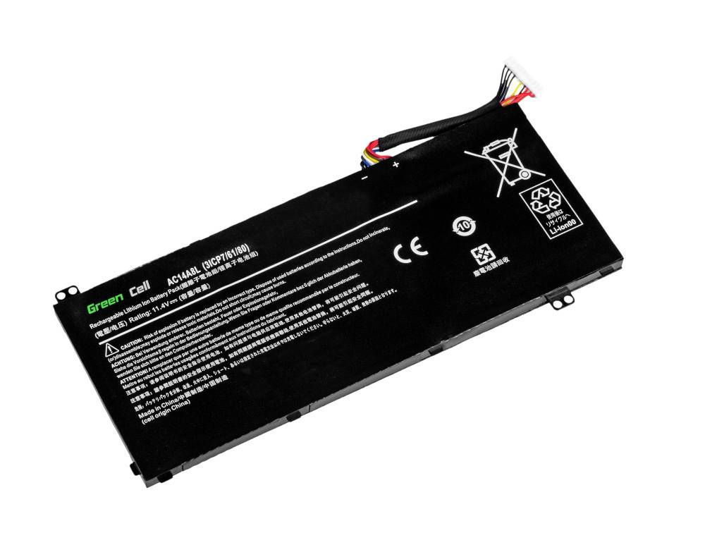 Batterie d'ordinateur portable avec spécifications techniques et avertissements sur une surface noire ; divers symboles de sécurité et de recyclage visibles.