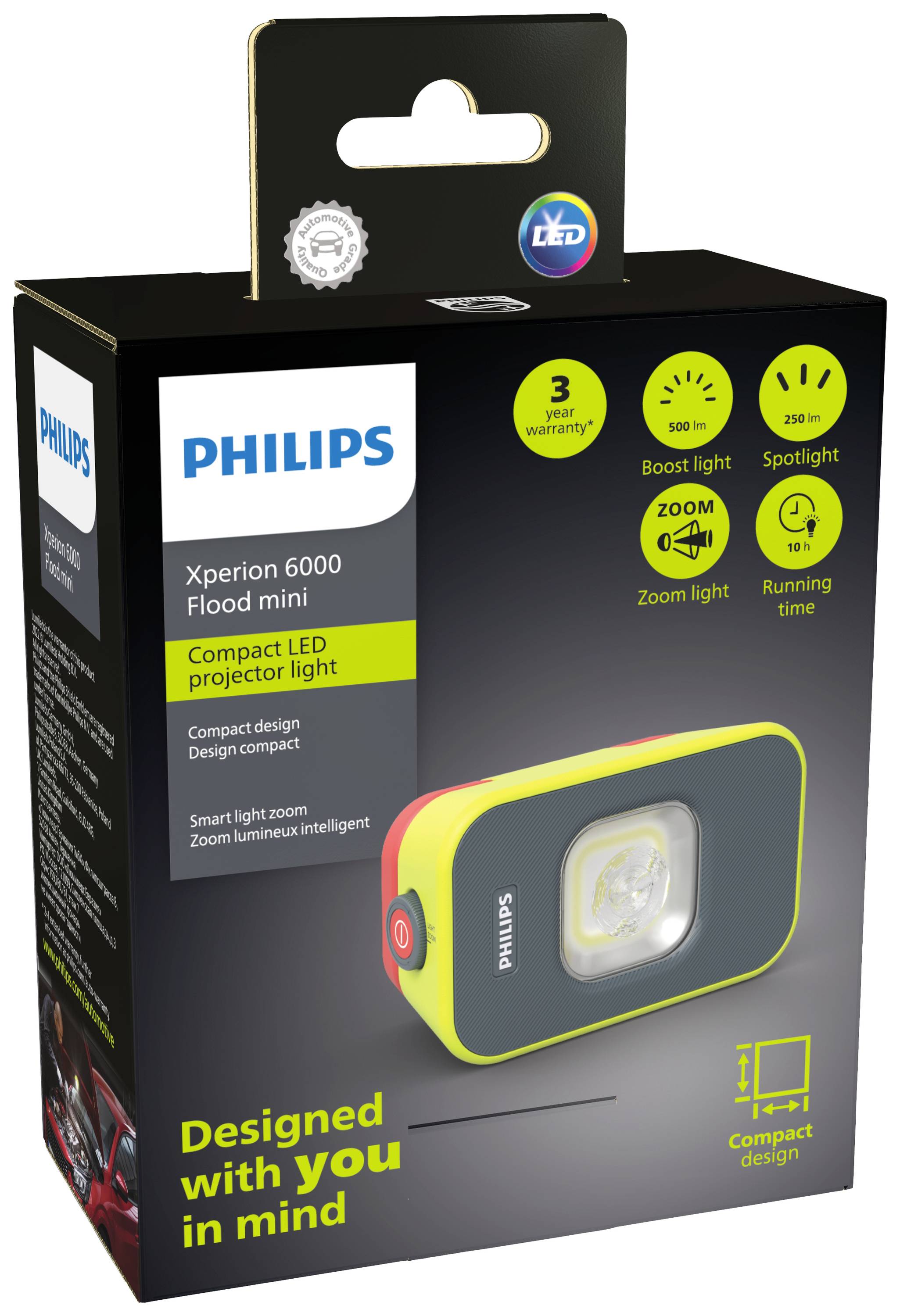 Emballage en carton d'un projecteur LED Philips. Caractéristiques principales : luminosité de 6000 lumens, économie d'énergie, garantie de 3 ans.