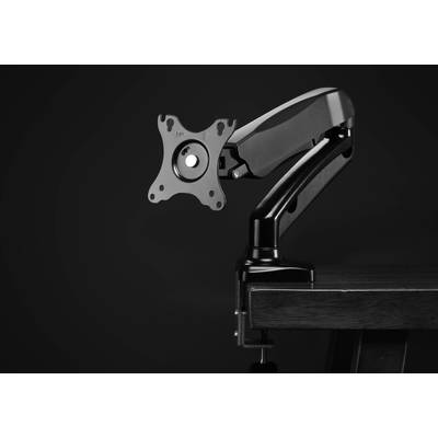 Un bras de moniteur noir sans écran est monté sur un bureau. Le bras est flexible et ajustable.