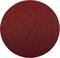 Un disque de papier de verre rond, rouge, à grain grossier, utilisé pour poncer et lisser les surfaces dans les projets artisanaux et de construction.