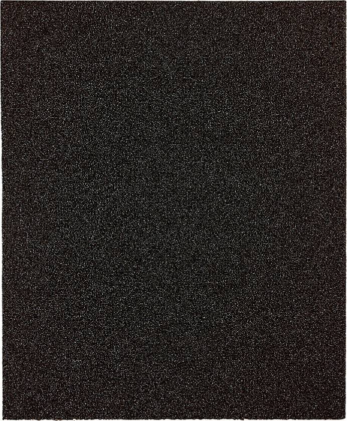 Gros plan sur une surface noire rugueuse, évoquant du papier de verre.