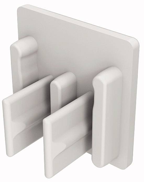 Un organisateur blanc en plastique avec quatre compartiments verticaux pour le rangement de documents ou d'appareils.
