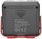 Verso d'un appareil électronique avec un boîtier gris et un support rouge. L'inscription indique le fabricant, l'adresse à Wertheim et les informations du produit.