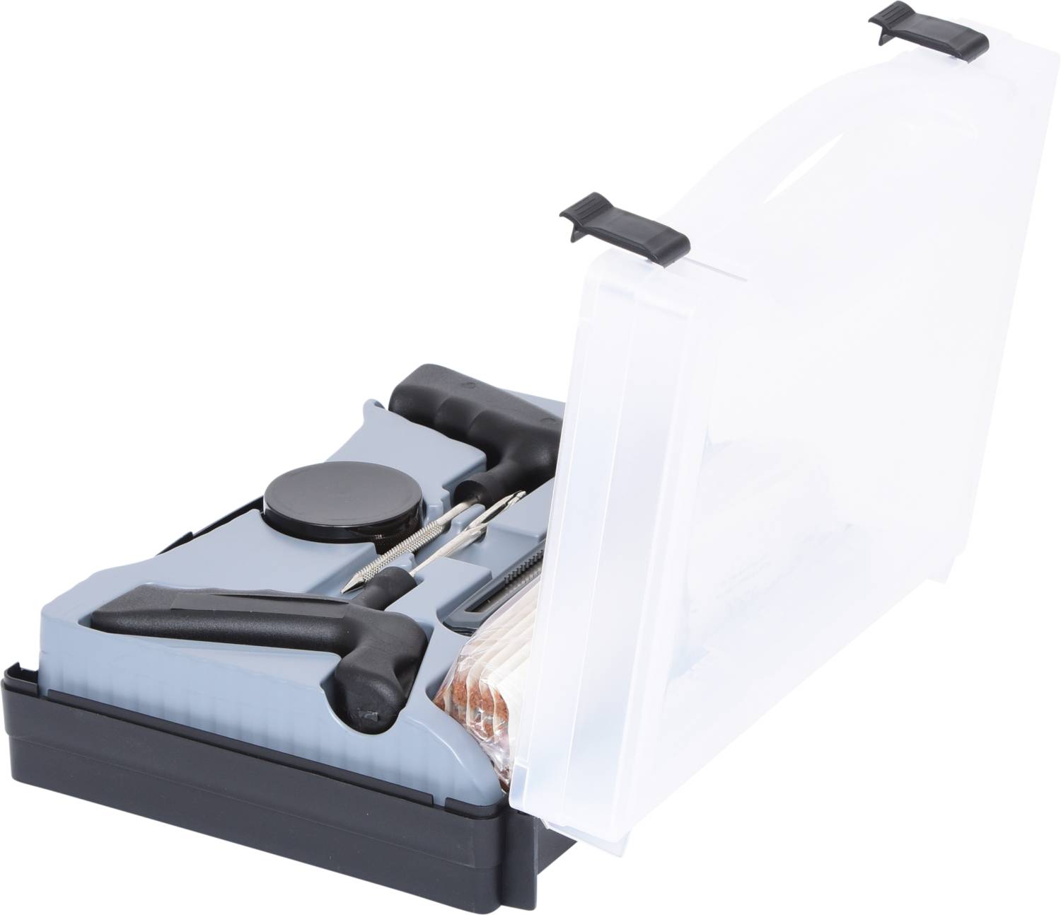 Un kit de réparation dans un coffret en plastique transparent ouvert. Il contient des outils et des accessoires pour la réparation de pneus.