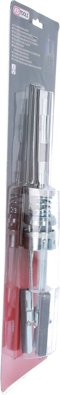 Emballage contenant un ensemble d'outils composé de différentes pièces en métal et en plastique, présenté sous blister.