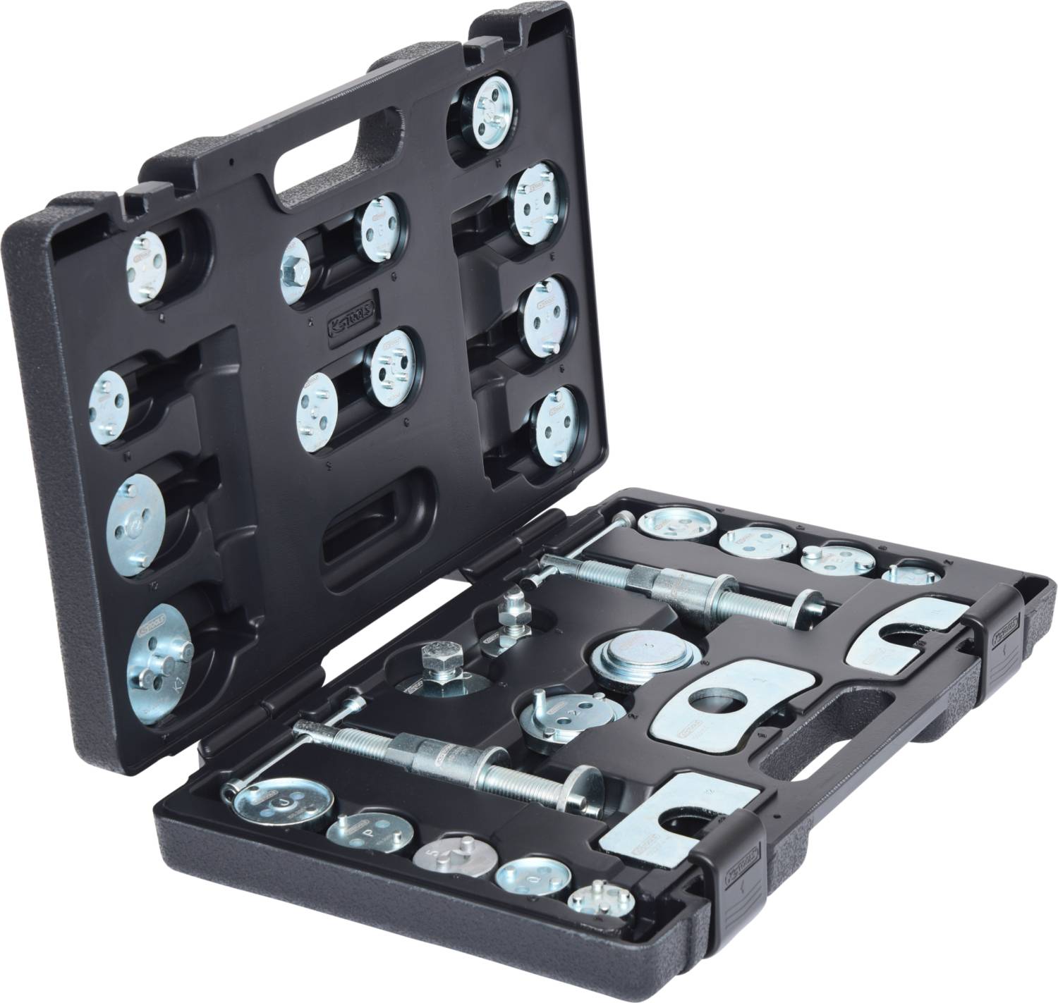 Une boîte à outils noire ouverte contenant divers éléments métalliques et vis utilisés pour le montage ou la réparation.