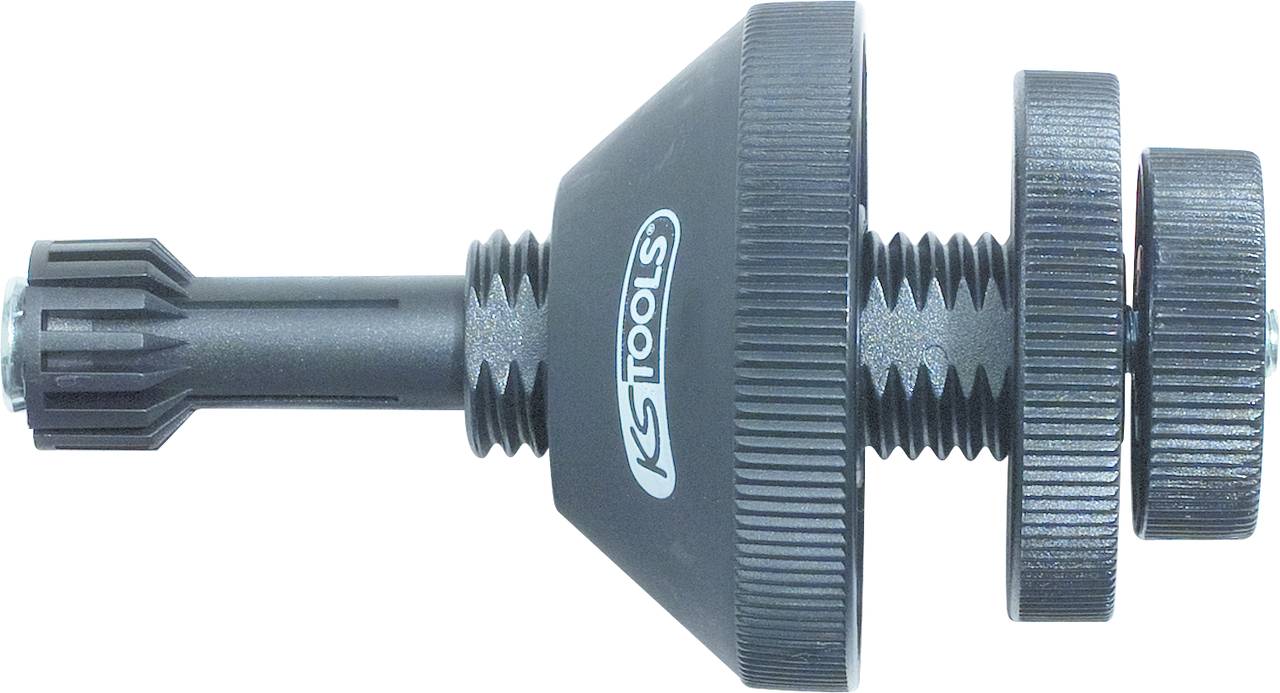 Un outil spécial noir portant l'inscription 'KS Tools', composé de plusieurs pièces filetées, probablement utilisé pour l'ajustement ou le montage.