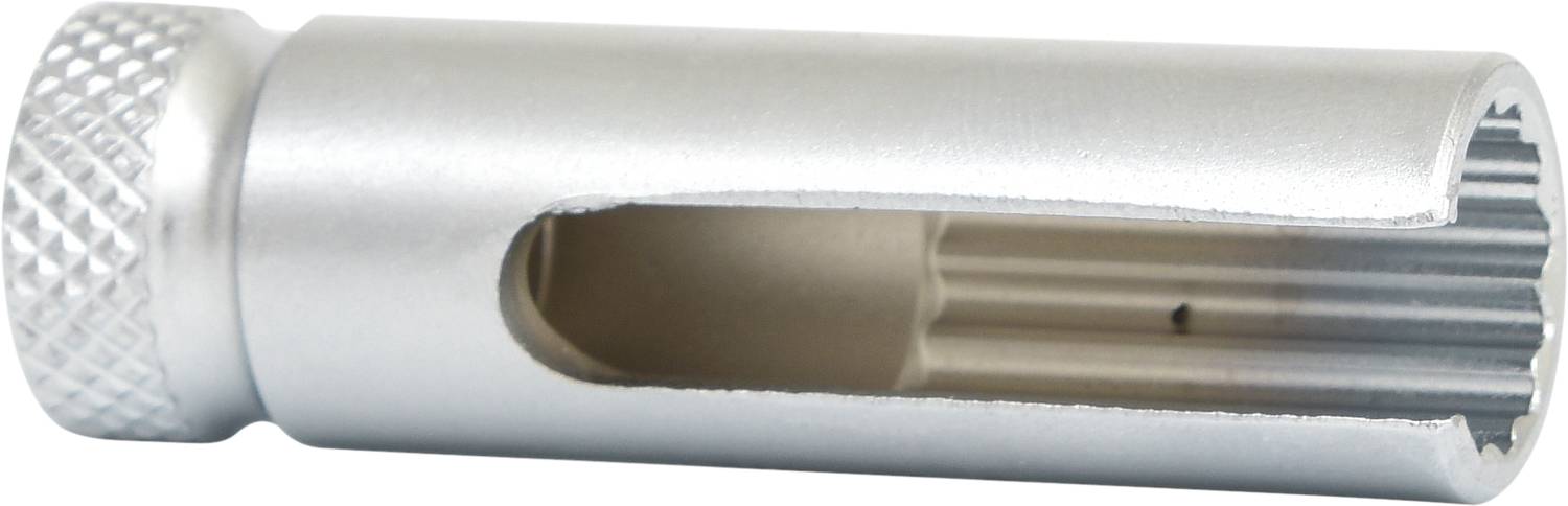 Cylindre métallique avec rainurage et zone évidée, probablement un composant d'outil ou de machine.