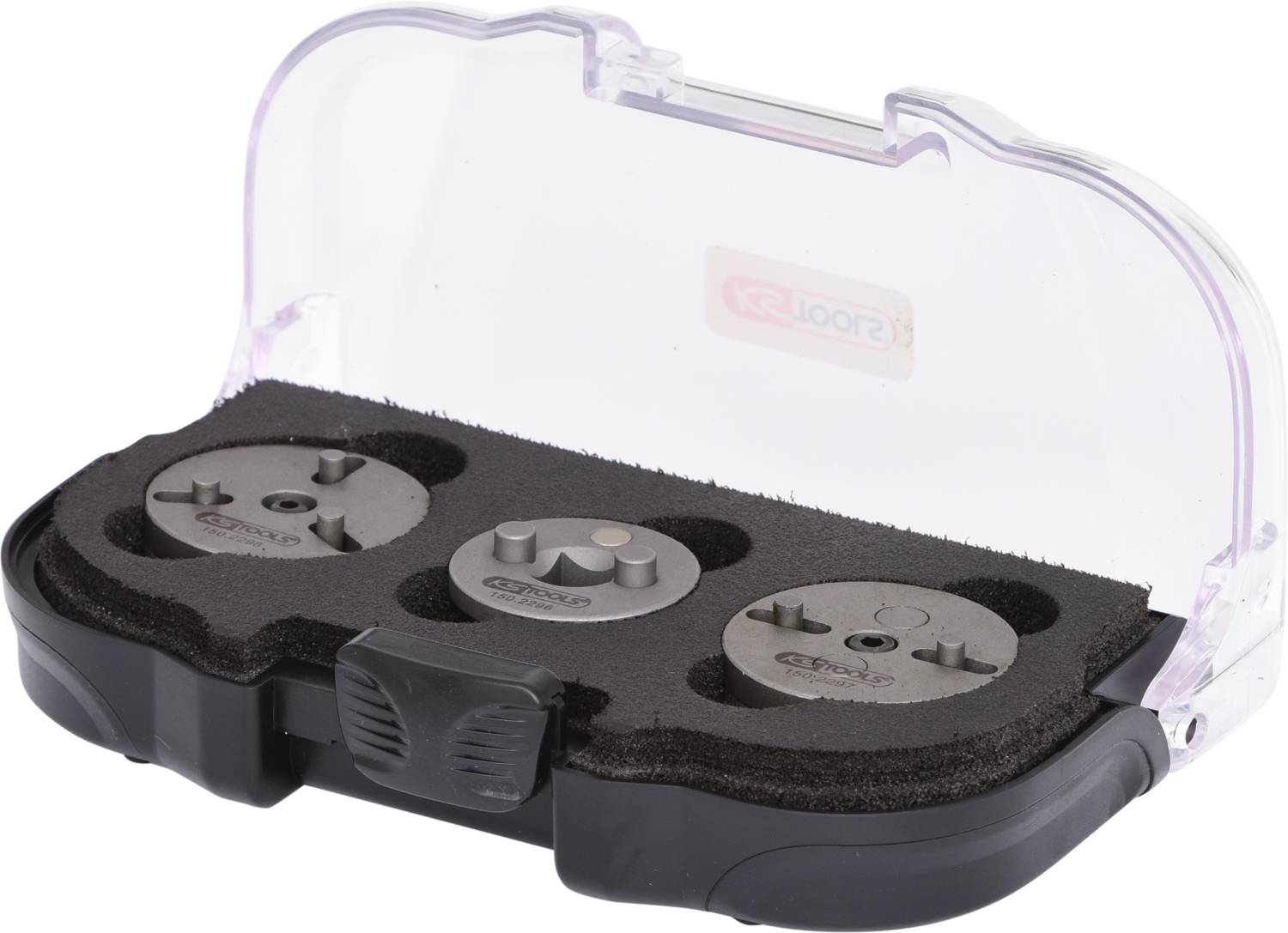 Étui transparent avec trois embouts métalliques ronds, garni de mousse, adapté à des outils électriques spécifiques.