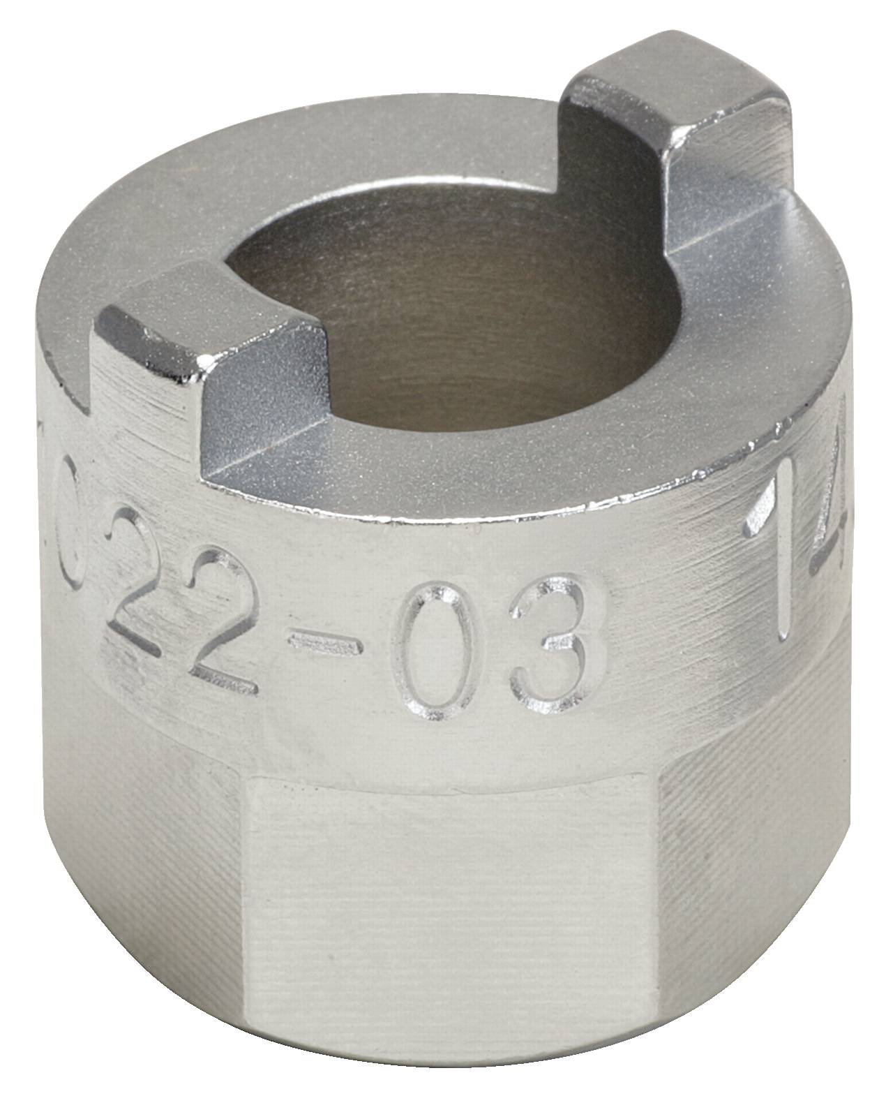 Clé à double profil denté en métal, de forme cylindrique, en acier inoxydable. Contient des numéros estampés sur le côté.