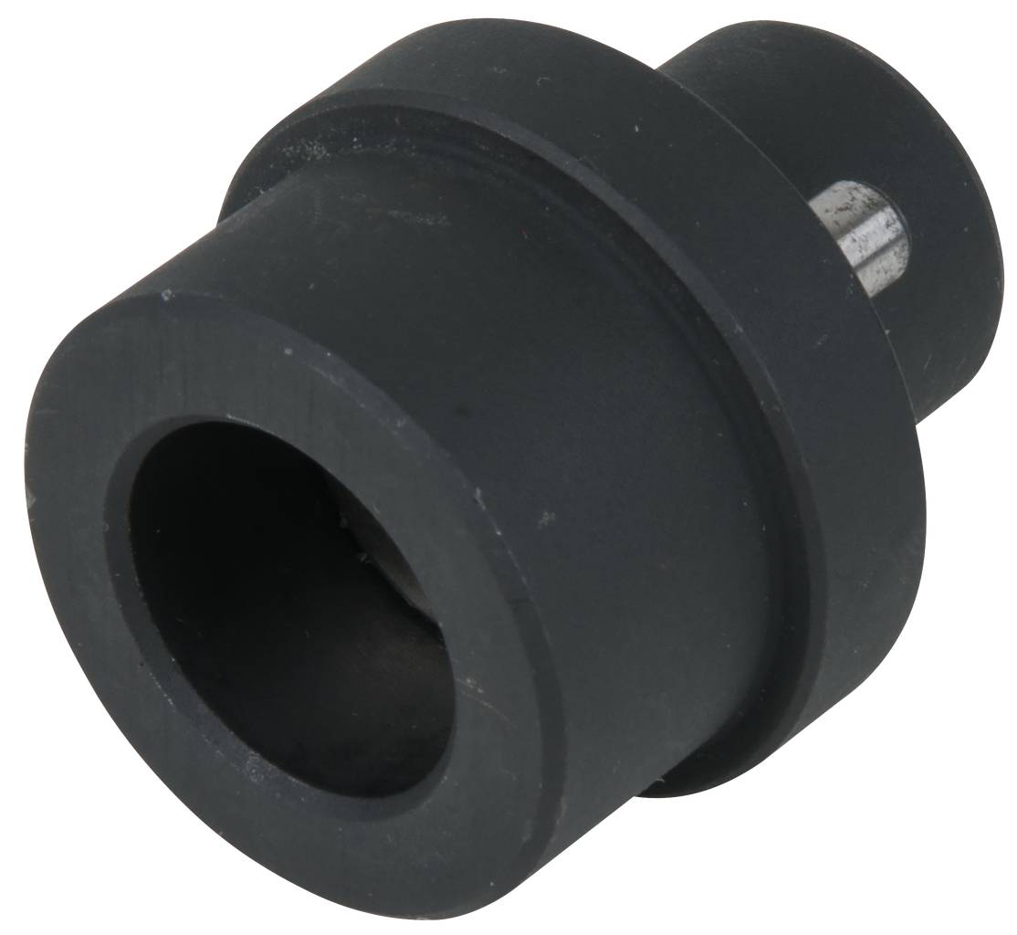 Une pièce métallique cylindrique noire avec une ouverture creuse et un ergot saillant, probablement un composant mécanique.