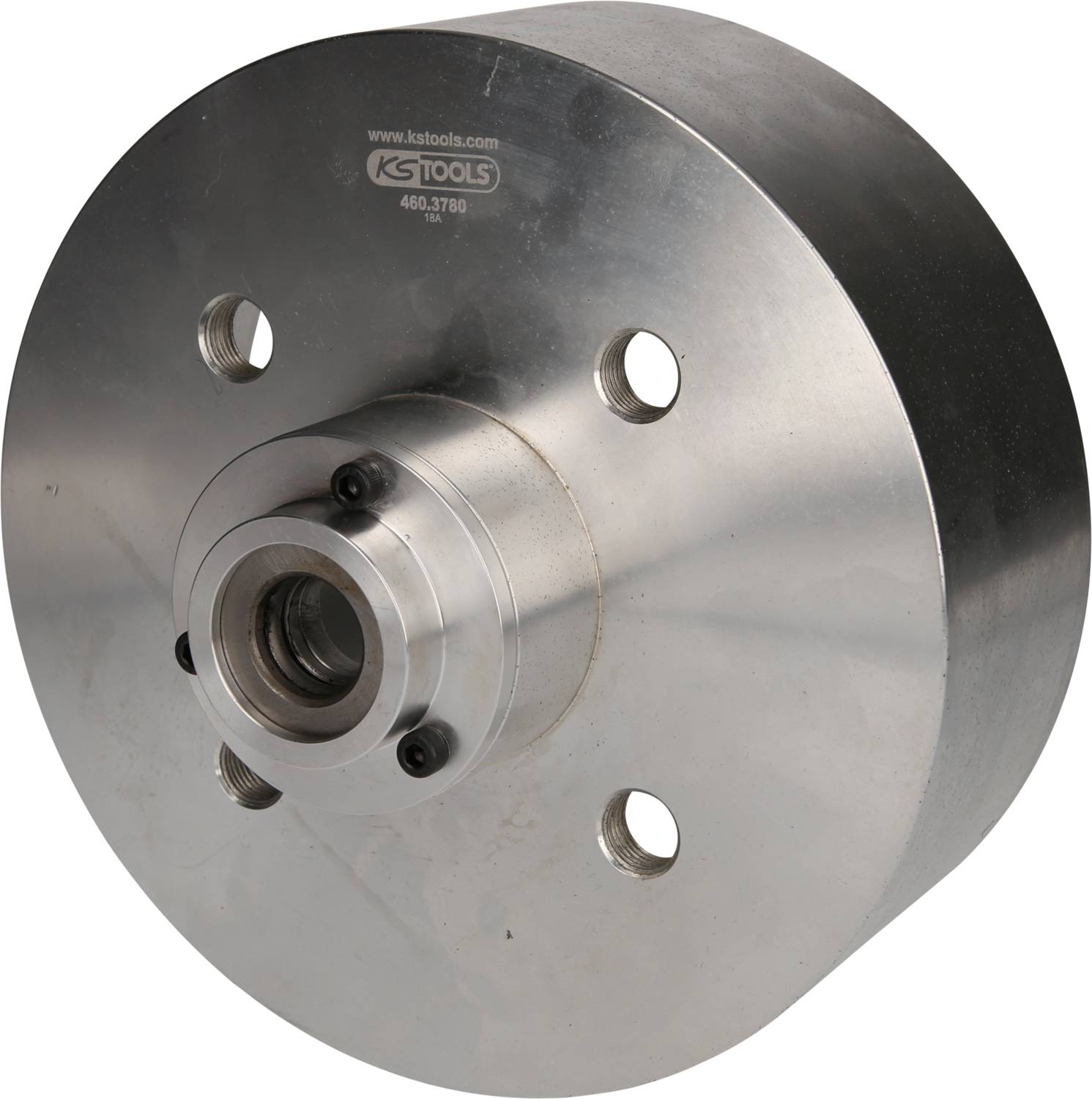 'Tête ronde métallique avec quatre perçages et un trou central, utilisée pour des applications mécaniques ou des fixations.'